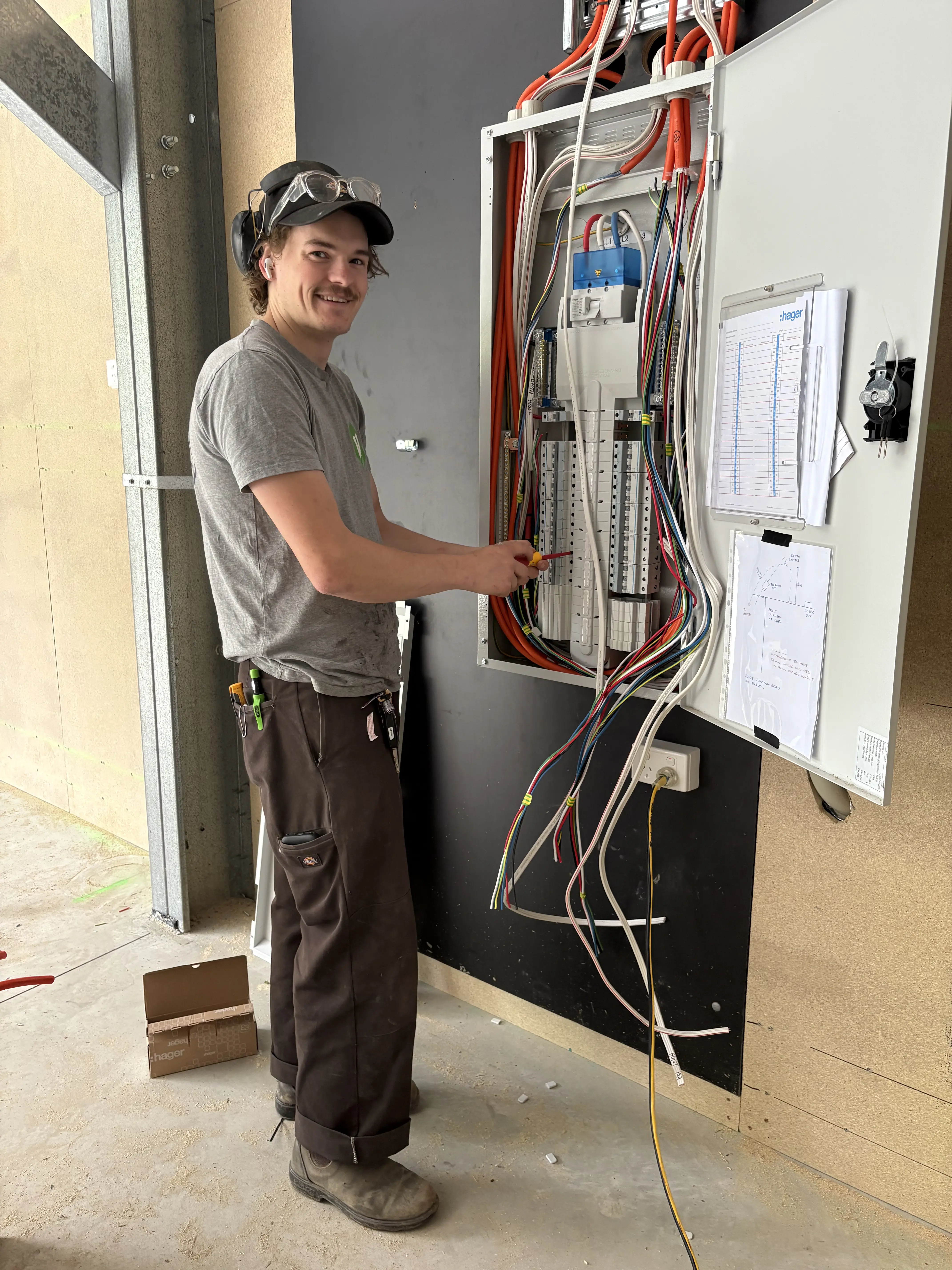 Fernhill Electrics owner working on a switchboard